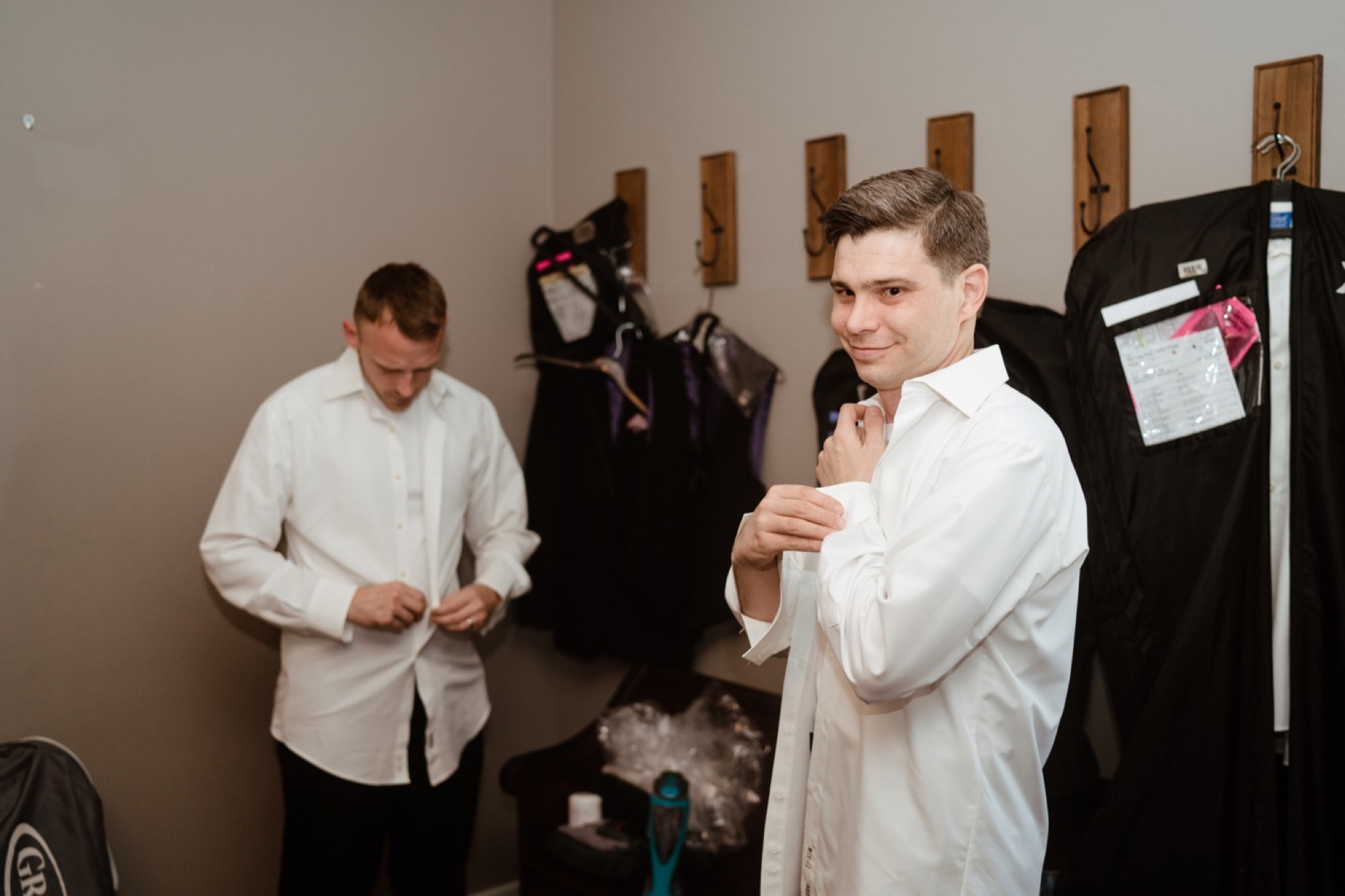 Groom getting ready during 8th and main wedding