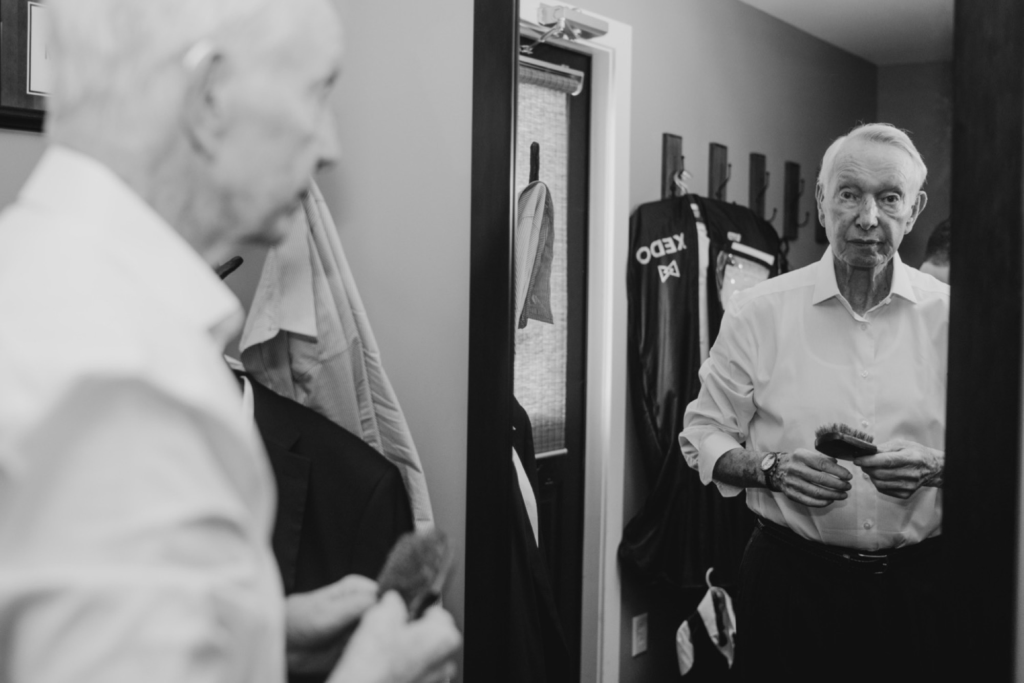 Grooms's grandfather gets dressed at 8th & Main Wedding