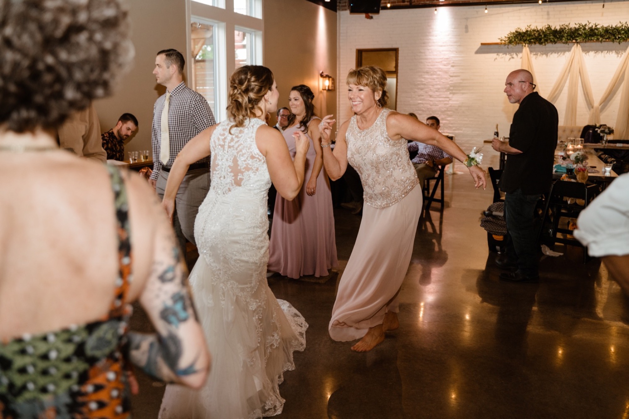 mother and daughter dance to footloose at 8th and main wedding