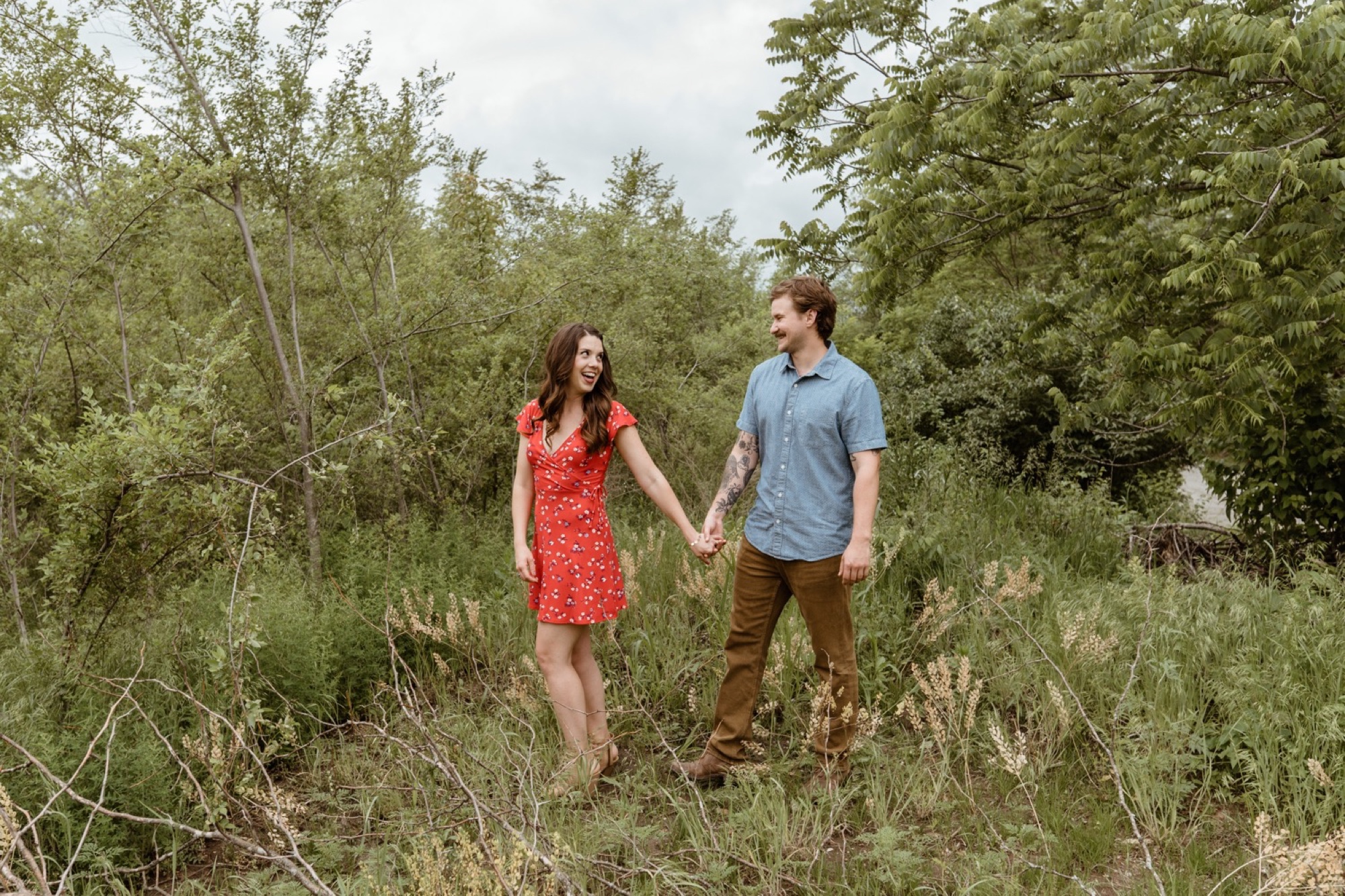 couple hand in hand for their winterset park engagement session