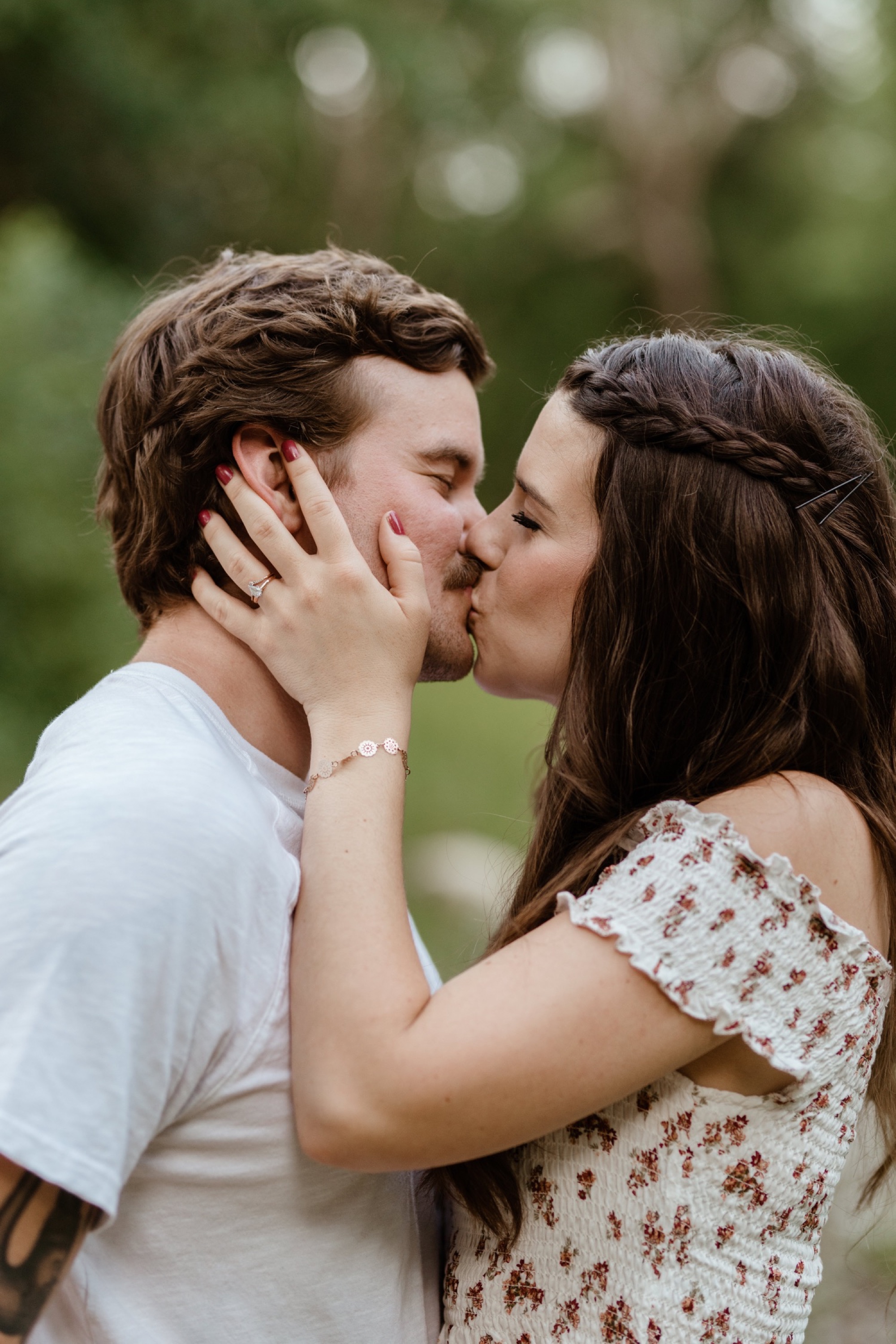 close up of couple kissing during winterset park engagement session