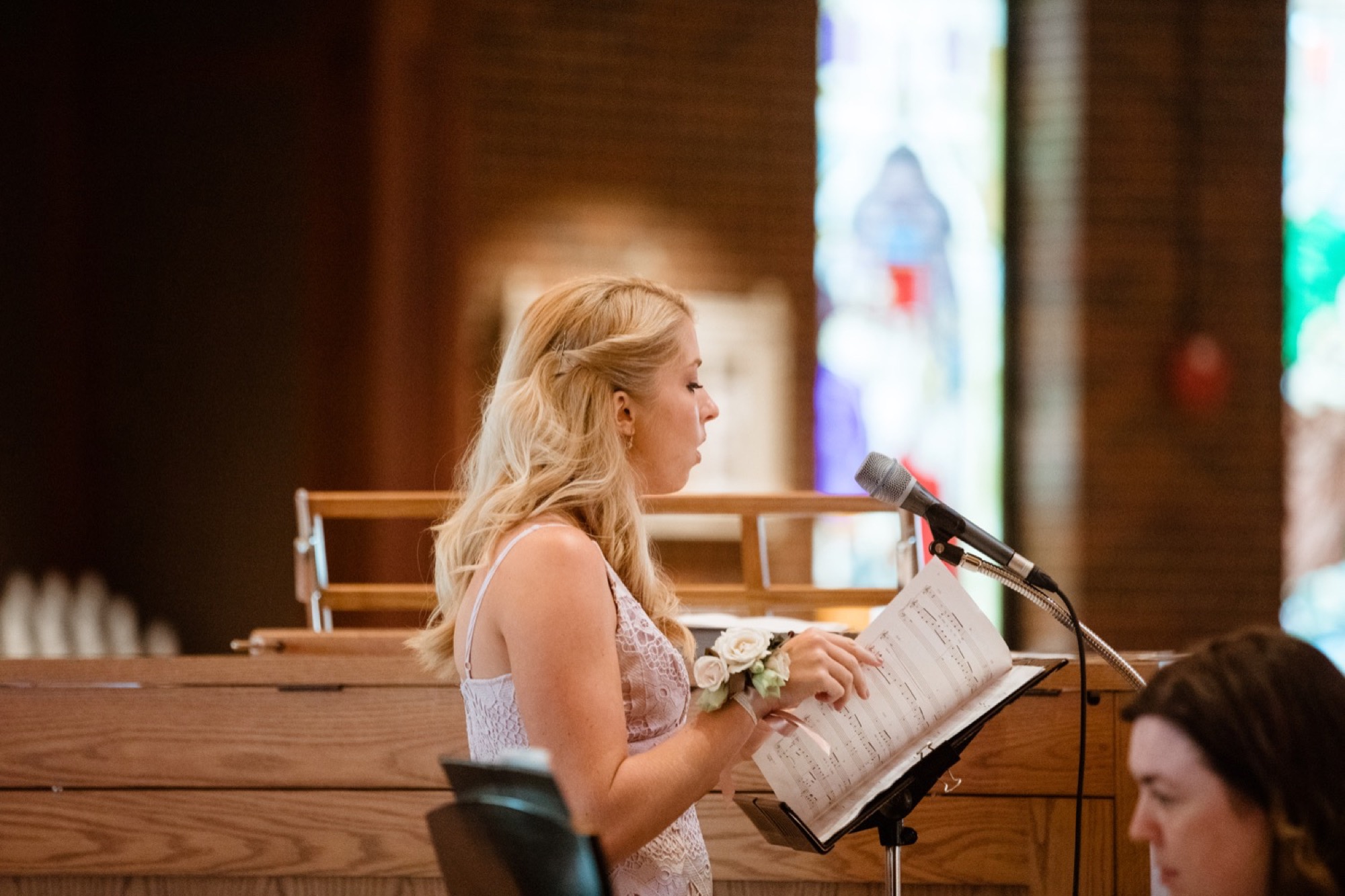 bridesmaid singing during wedding at st joseph catholic church