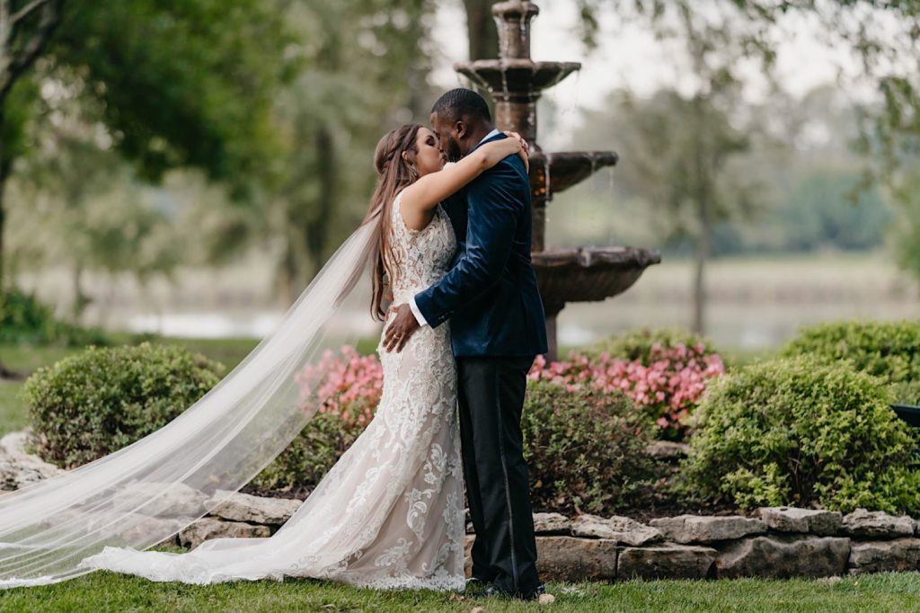 couple shares first kiss during their intimate backyard wedding