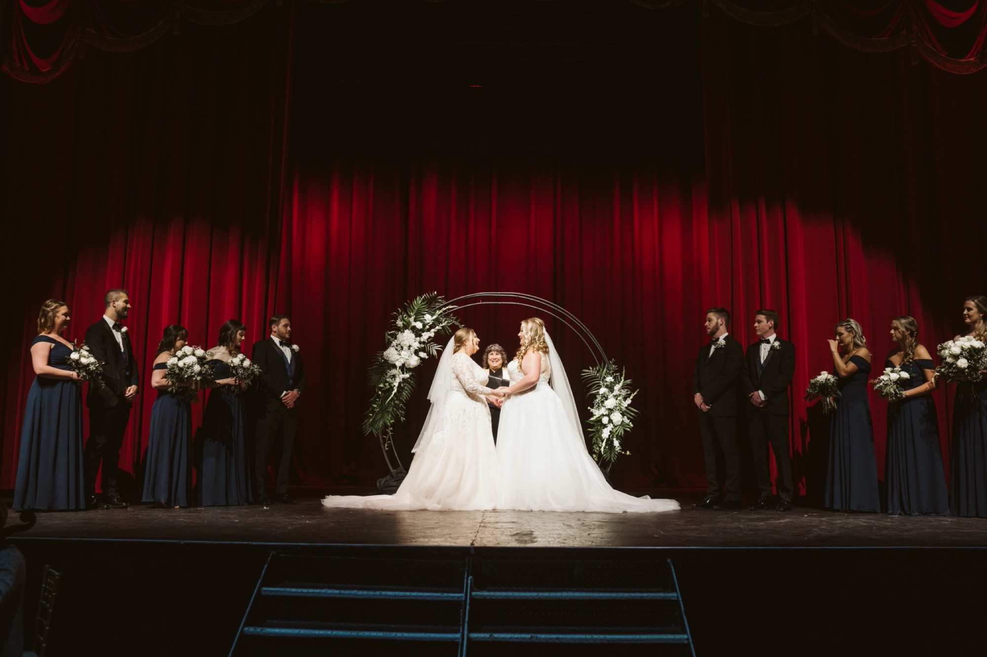 Uptown Theater Wedding brides on the stage during marriage ceremony