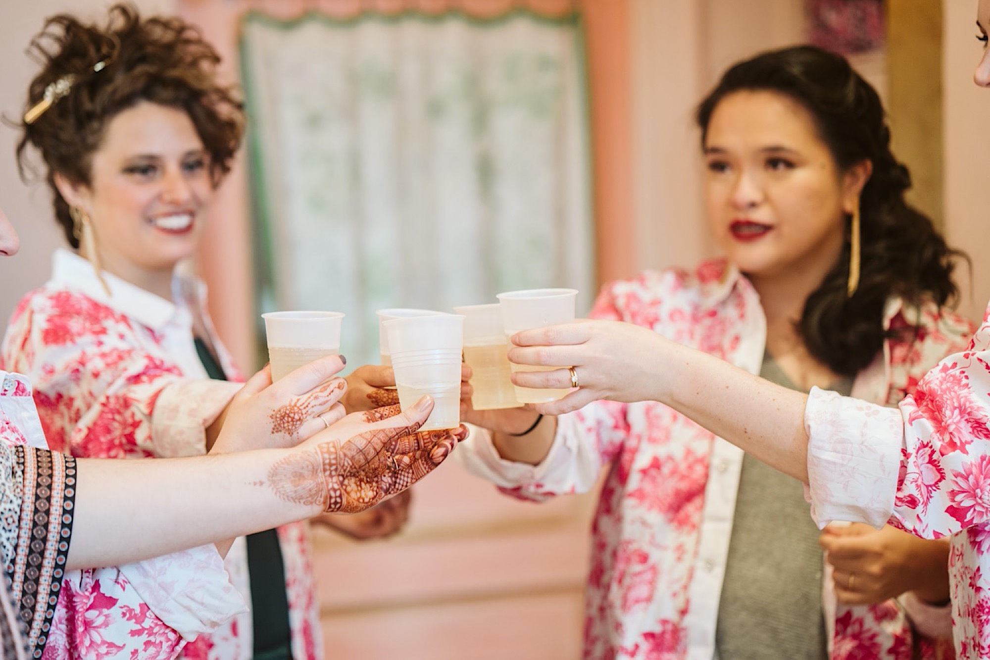 wedding party toasts each other during bride and bauer sustainable wedding
