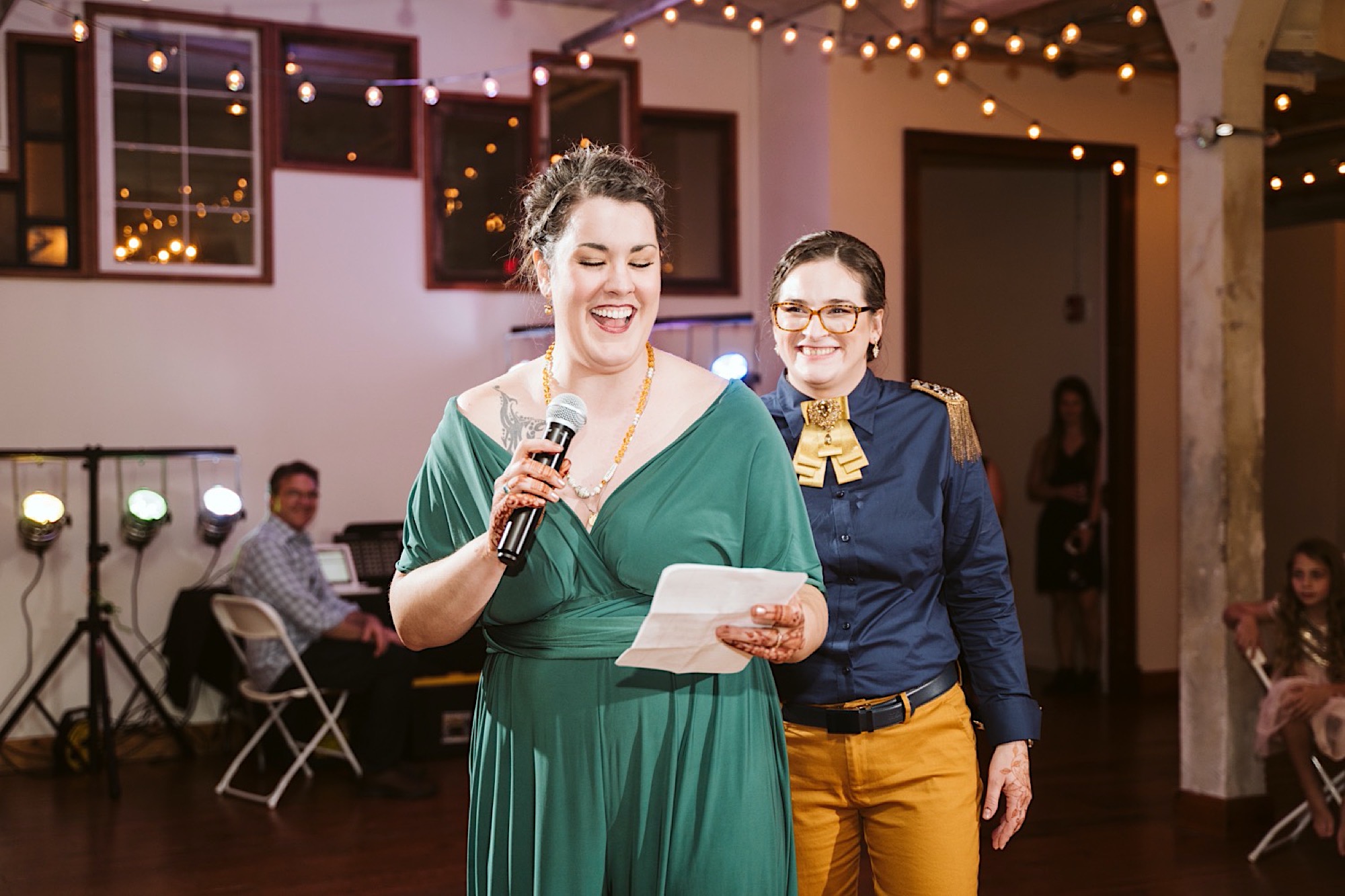 brides read speech during reception of bride and bauer sustainable wedding