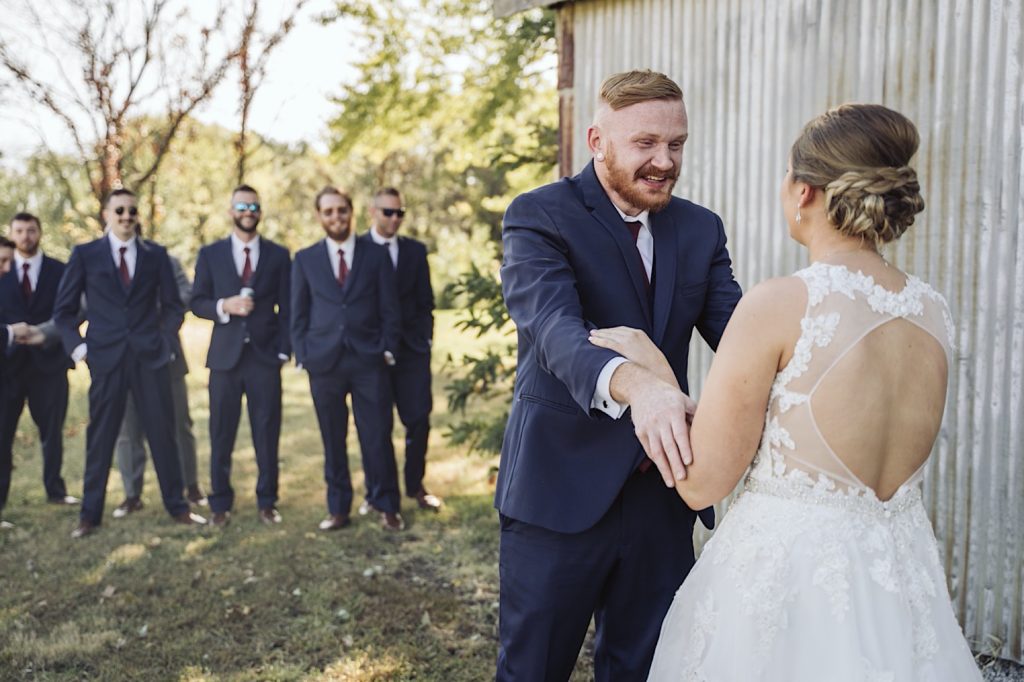 groom sees bride for the first time during sweet clover farm wedding