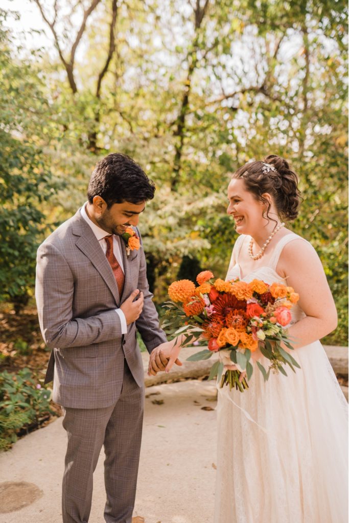 couple has first look during overland park arboretum wedding