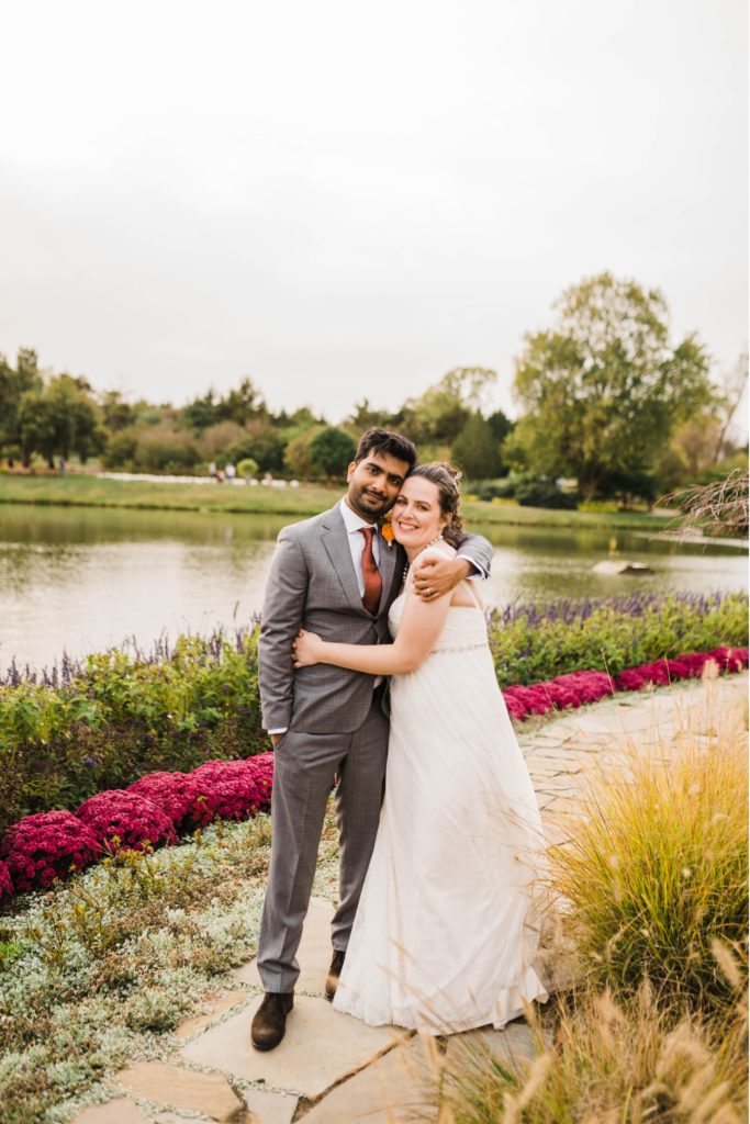 Newlywed couple walks through the Overland Park Arboretum Wedding