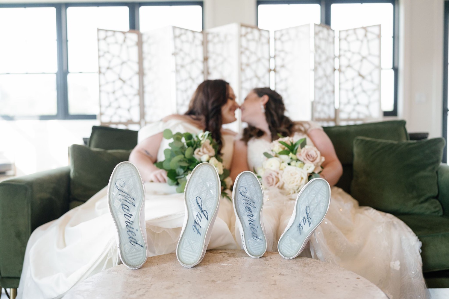 Married couple shows custom converse on wedding day in Kansas City